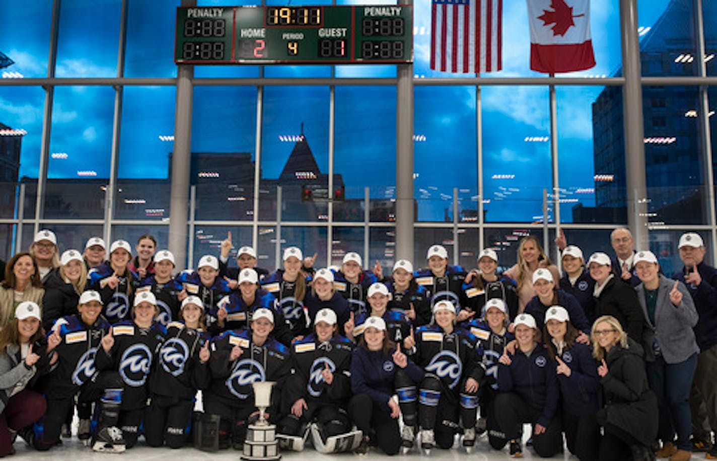 Whitecaps players celebrated with the Isobel Cup after beating the Buffalo Beauts 2-1 in overtime for the NWHL championship on March 17 at TRIA Rink in St. Paul.