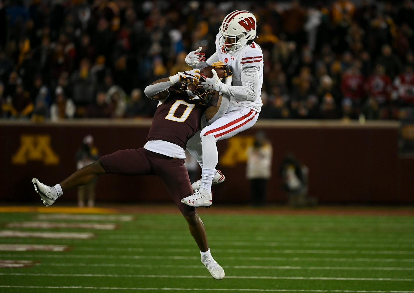 Minnesota Gophers defensive back Justin Walley (0) intercepted a ball intended for Wisconsin Badgers wide receiver Kendric Pryor (3) during the third quarter of an NCAA football game between the Gophers and the Wisconsin Badgers Saturday, Nov. 27, 2021 at Huntington Bank Stadium in Minneapolis, Minn. Minnesota defeated Wisconsin 23-13. ] AARON LAVINSKY • aaron.lavinsky@startribune.com