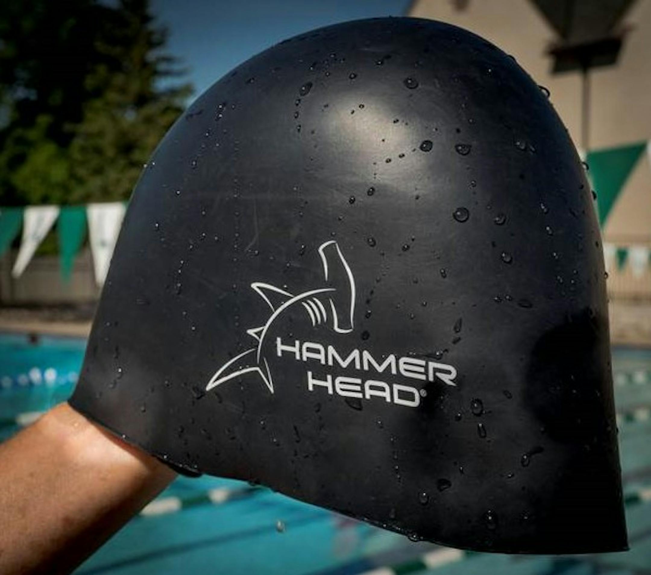 Hammer HeadÆ Swim Caps ñ a new U.S.- designed and manufactured swim cap. The Hammer Head cap looks and feels like a standard issue silicone swim cap but incorporates new, patent-pending HIT Honeycomb Impact Technologyô designed to help absorb the shock of impact from collisions with the pool wall and other aquatic athletes.