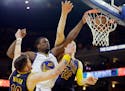 Warriors forward Harrison Barnes dunked over Cavaliers guard Mike Miller, left, and center Timofey Mozgov during the second half of Game 5 of the NBA 