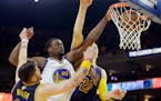 Warriors forward Harrison Barnes dunked over Cavaliers guard Mike Miller, left, and center Timofey Mozgov during the second half of Game 5 of the NBA 