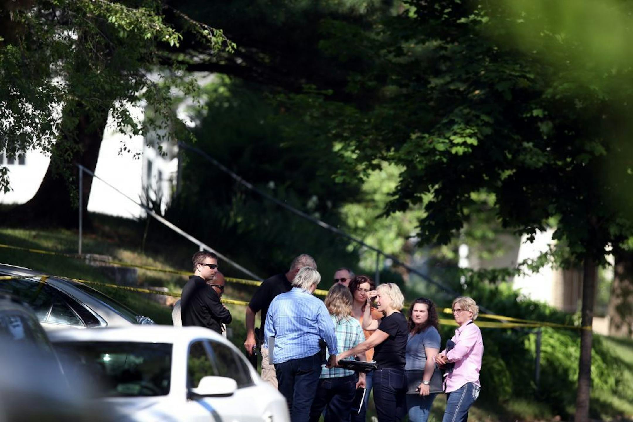 St. Paul police and Minnesota BCA investigators talked on Minnehaha Avenue E. in St. Paul after an officer-involved shooting left a man dead.