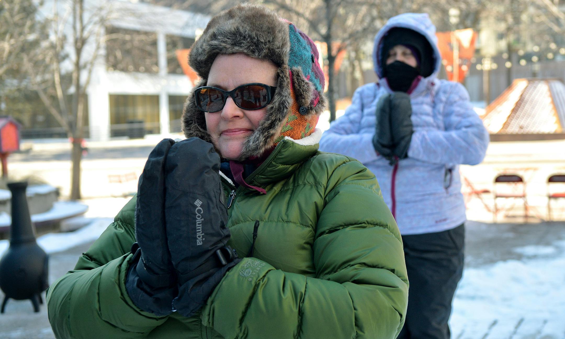 Yoga enthusiasts of all ages and skill levels endured arctic wind chills in support of Yess Yoga's second annual Snoga. ] (SPECIAL TO THE STAR TRIBUNE/BRE McGEE) **Diane Docis (background, white jacket), Elisabeth Pletcher-Harincar (front, green coat)