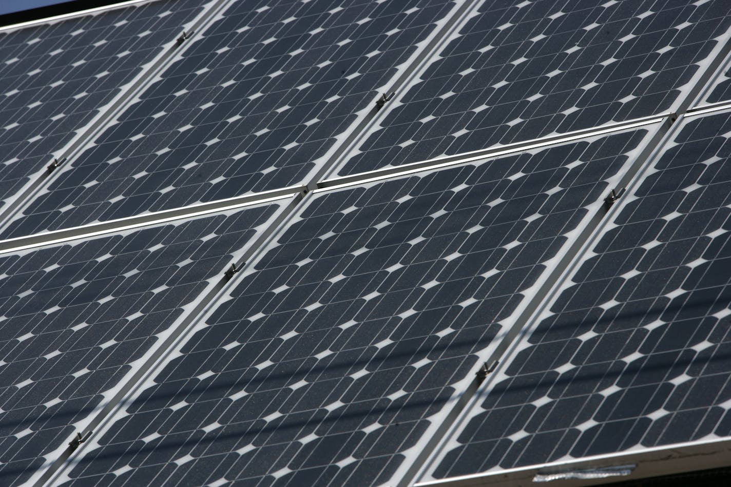 joel koyama•jkoyama@startribune.com solar0602 00008066a] ¤Chris Born's north Mpls house has a garage covered with solar panels. It supplies 125 percent of the power needs for his property. He sends the surplus to Xcel, but the plan is to power his plug-in electric car soon.