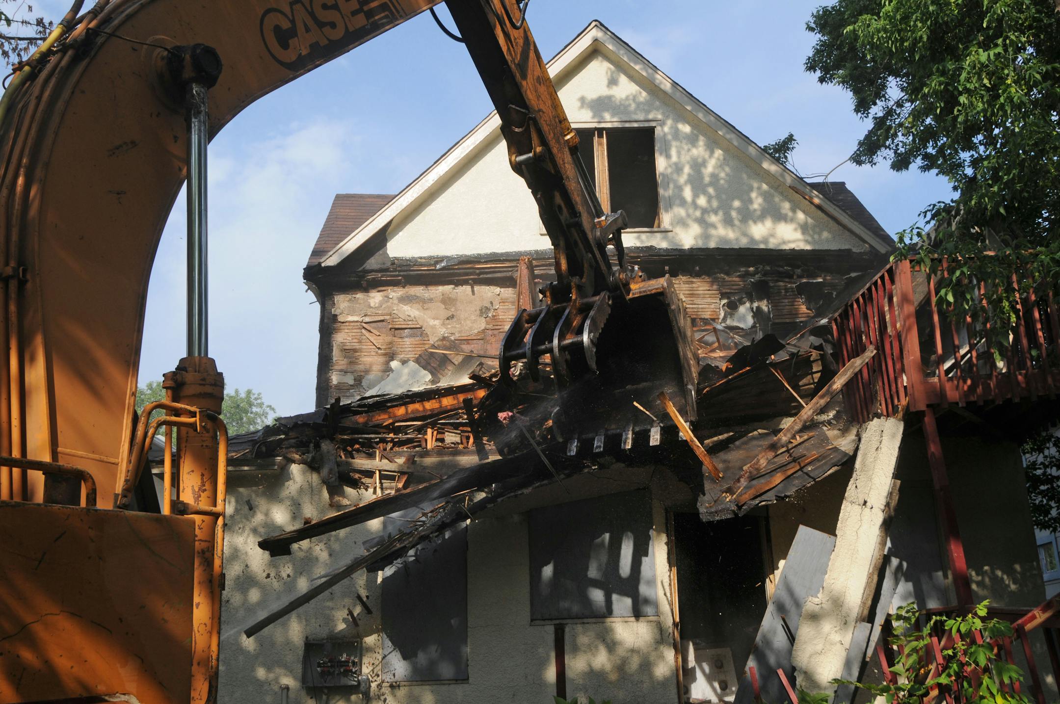 Demolition crews tear down this house at 2914 Dupont Ave N. Minneapolis.