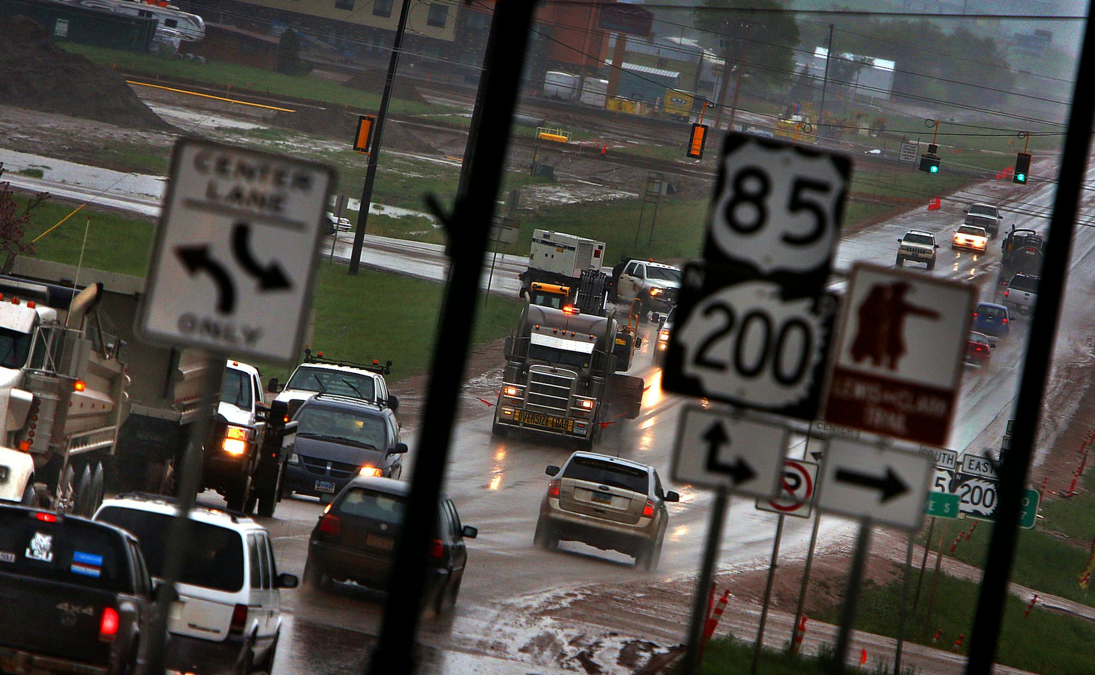 Watford City is congested much of the day, as traffic from all aspects of the oil fields converge at the cross roads. ] (JIM GEHRZ/STAR TRIBUNE) / September 26, 2013, Watford City, ND ‚Äì BACKGROUND INFORMATION- PHOTOS FOR USE IN FIRST PART OF NORTH DAKOTA OIL BOOM PROJECT: Dozens of drilling rigs dot the North Dakota landscape in the Williston Basin and the Bakken Oil Formation. Once the rigs drill holes, several miles deep and then several miles horizontally, hydraulic fractur