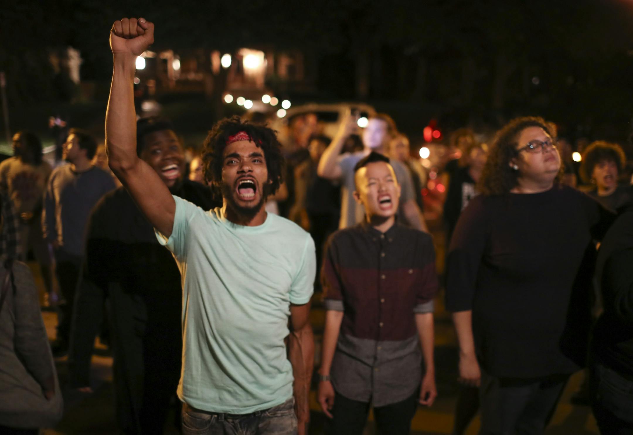 Angry demonstrators chanted and honked horns as they blocked Summit Avenue in front of the governor's residence in St. Paul early Thursday morning, July 7, 2016.