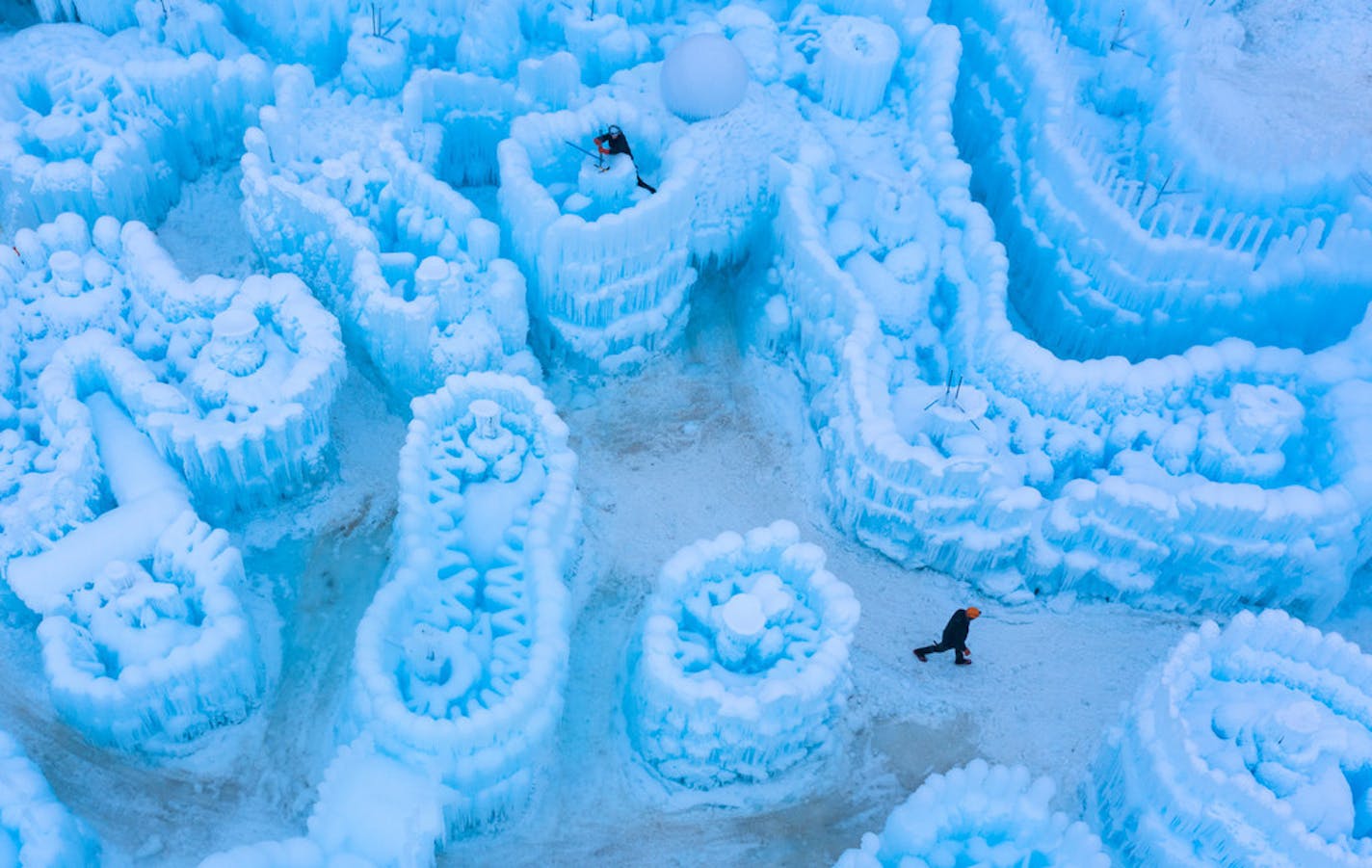 Workers put the final touches on the Ice Castles display that makes its debut Friday night at Ramsey County's Long Lake Regional Park in New Brighton.