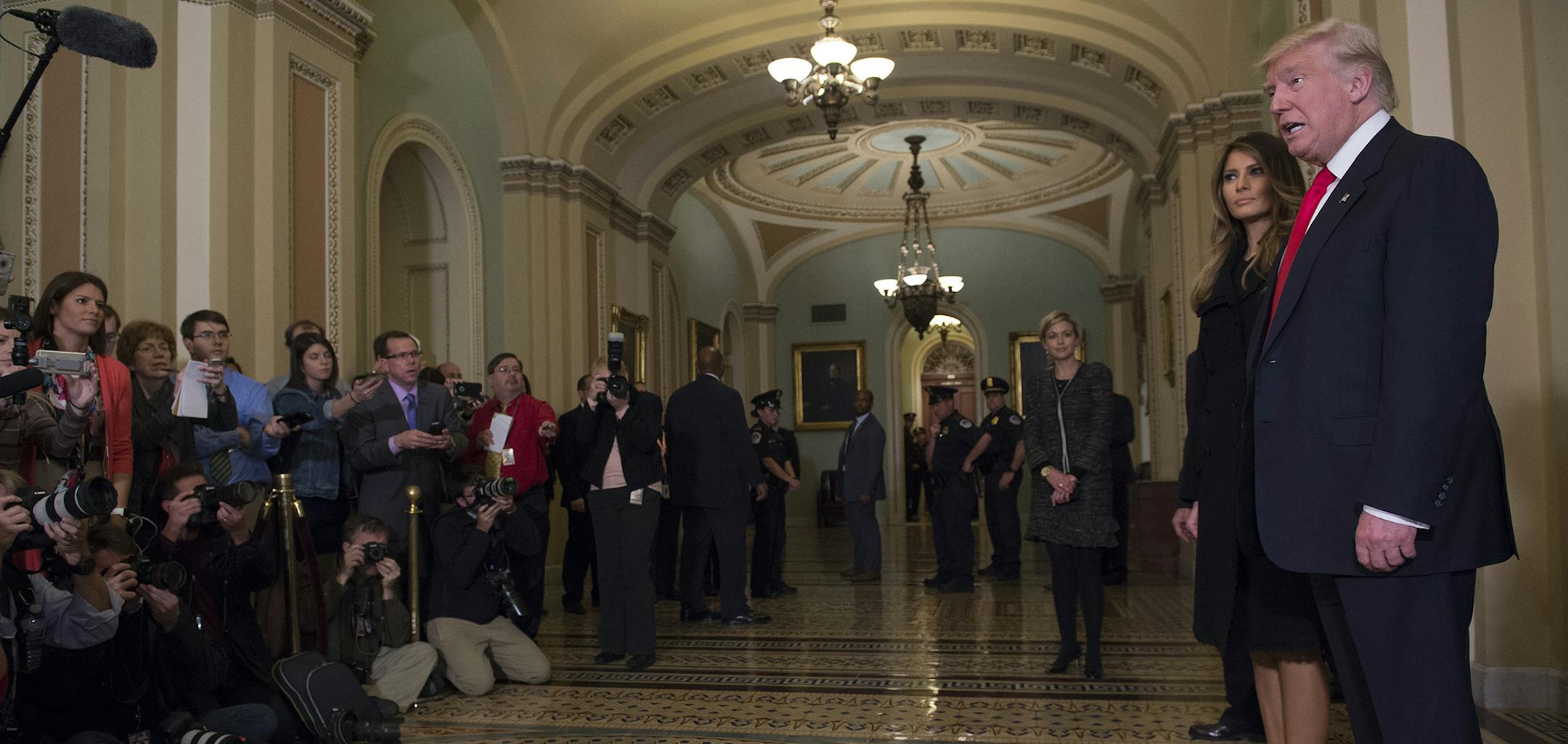 President-elect Donald Trump, accompanied by his wife Melania, speaks to the media on Capitol Hill in Washington, Thursday, Nov. 10, 2016, after meeting with Senate Majority Leader Mitch McConnell of Ky. (AP Photo/Molly Riley) ORG XMIT: MIN2016111111184009