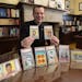 The Rev. John Ubel with some of his childhood baseball cards auctioned in 2021 to fund scholarships to help students to attend Catholic grade schools.