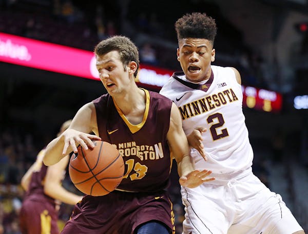 Crookston's Kobe Critchley was pressured by Minnesota's Nate Mason in the second half at Williams Arena November 1, 2015 in Minneapolis, MN. Minnesota