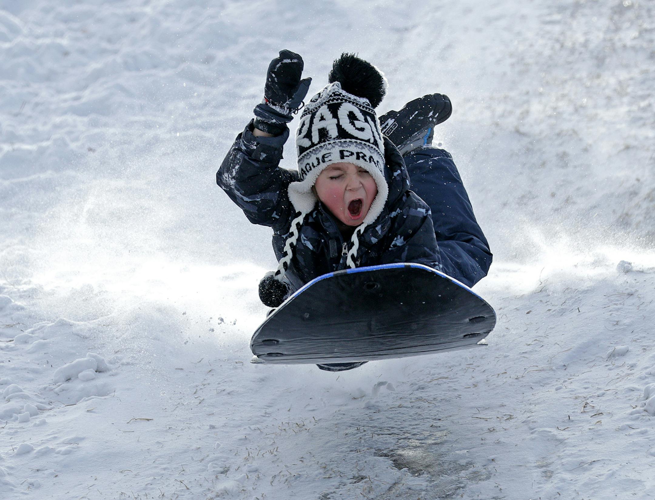 The hill along Minnehaha Creek near Cedar Ave. and 49th Street was a sledders paradise Monday afternoon with a fresh coat of snow and temps still above zero. Here, 6-year-old George Inz got some good air on one trip down the hill on January 28, 2019.