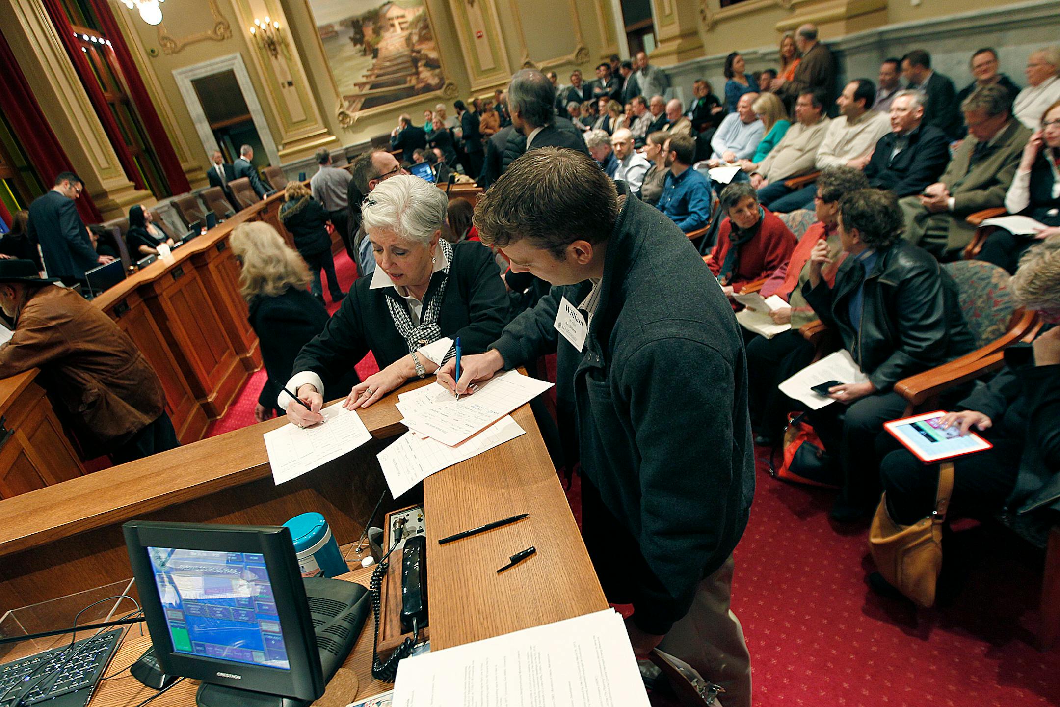 Concerned citizens signed up to speak during a public hearing regarding the Linden Hills, Fulton, Armatage, Kenny and Lynhurst teardown moratorium, at the Zoning and Planning Committee meeting at Minneapolis City Hall, Thursday, March 20, 2014.