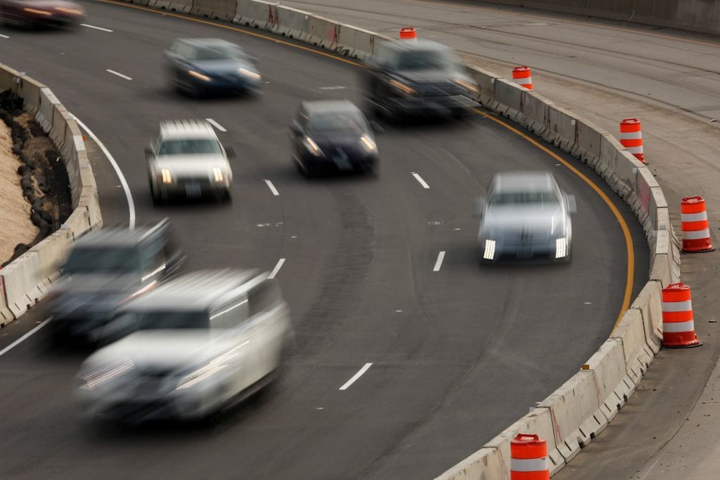 Commuters passed by ongoing road construction on I-35W during the evening rush hour Friday.