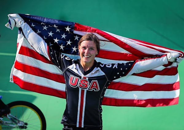 St. Cloud's Alise Post celebrates after riding to a silver medal in the women's BMX cycling Friday afternoon during the 2016 Summer Olympics in Rio de