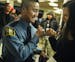 OfficerAlix(cq) Chance, who is on leave, congratulated officer Ler Htoo ,At Johnson High School. He was part of the St. Paul Police's class of 47 recr