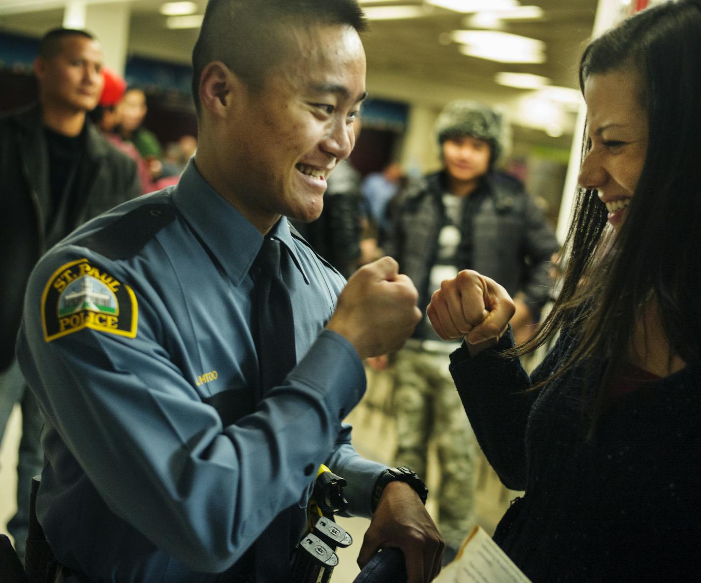 OfficerAlix(cq) Chance, who is on leave, congratulated officer Ler Htoo ,At Johnson High School. He was part of the St. Paul Police's class of 47 recruits graduating. He is the state's first Karen officer and perhaps the first Karen officer in the U.S. Chance who worked with Htoo said he was enthusiastic, caring, and always willing to help: qualities that will make him a good officer, she said. Richard Tsong-Taatarii/rtsong-taatarii@startribune.com