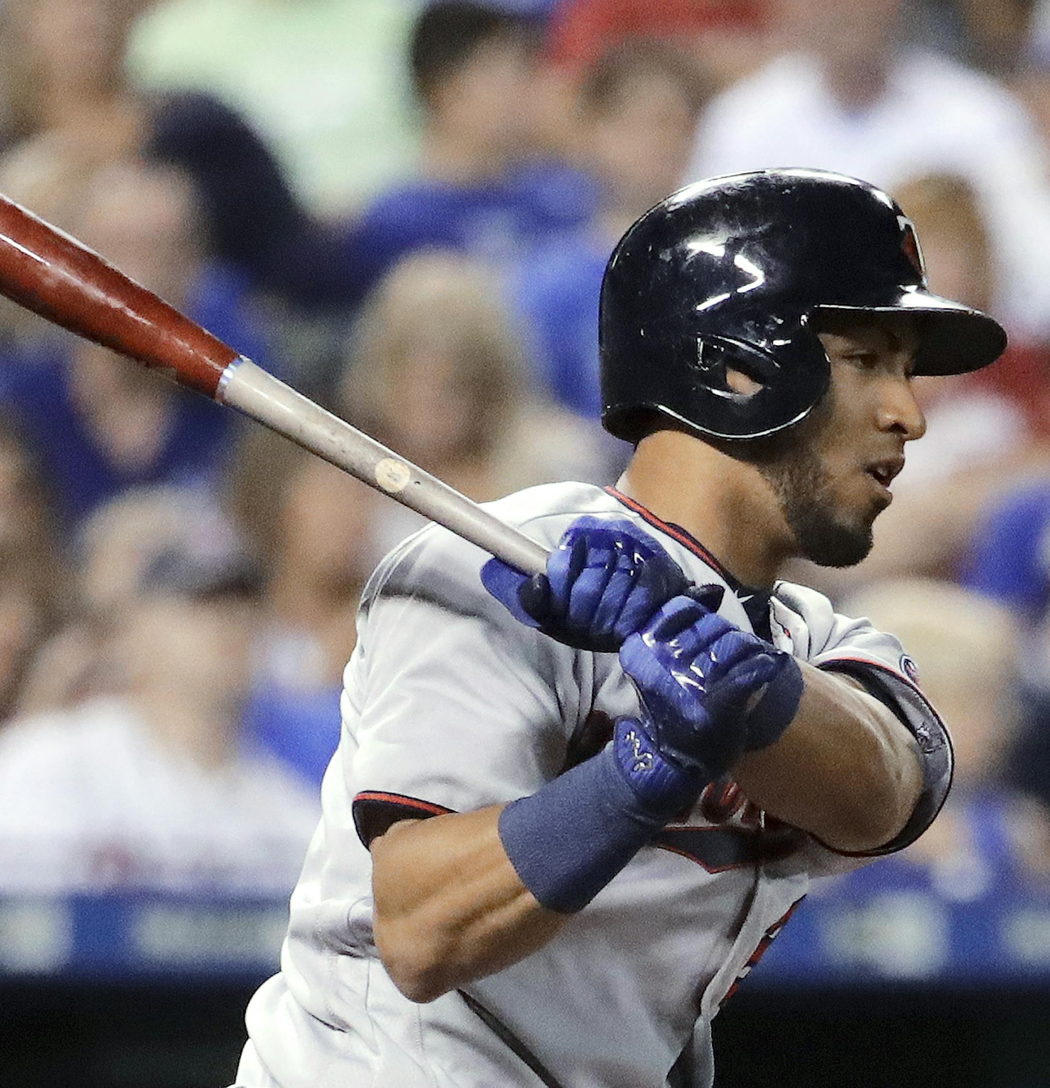 Minnesota Twins' Eddie Rosario watches his two-run single during the fourth inning of a baseball game against the Kansas City Royals on Friday, Sept. 8, 2017, in Kansas City, Mo. (AP Photo/Charlie Riedel)
