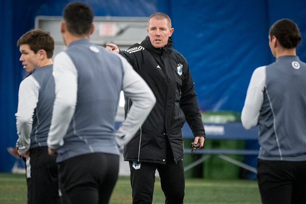 Interim head coach Cameron Knowles talked to players during Minnesota United practice at the National Sports Center in Blaine.