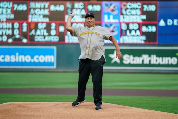Frank White threw out the first pitch before a Twins game.