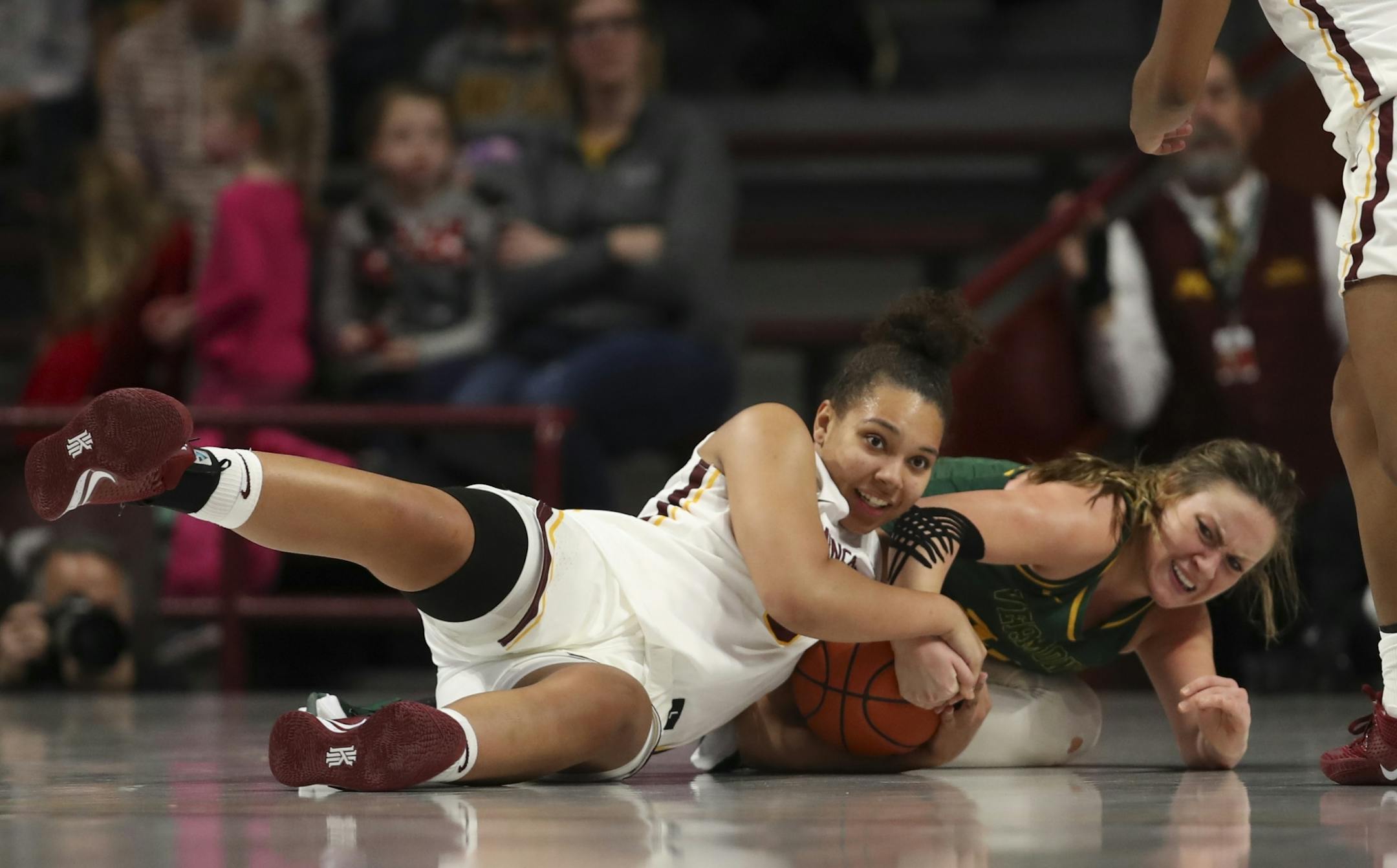 Minnesota Golden Gophers guard Destiny Pitts (3) held onto a loose ball despite the efforts of Vermont Catamounts guard Rose Caverly (24) in the second half.