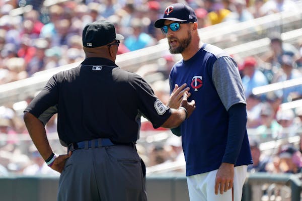 Rocco Baldelli (5) exchanged words with umpire Laz Diaz (63) on the field in the second inning on Wednesday.