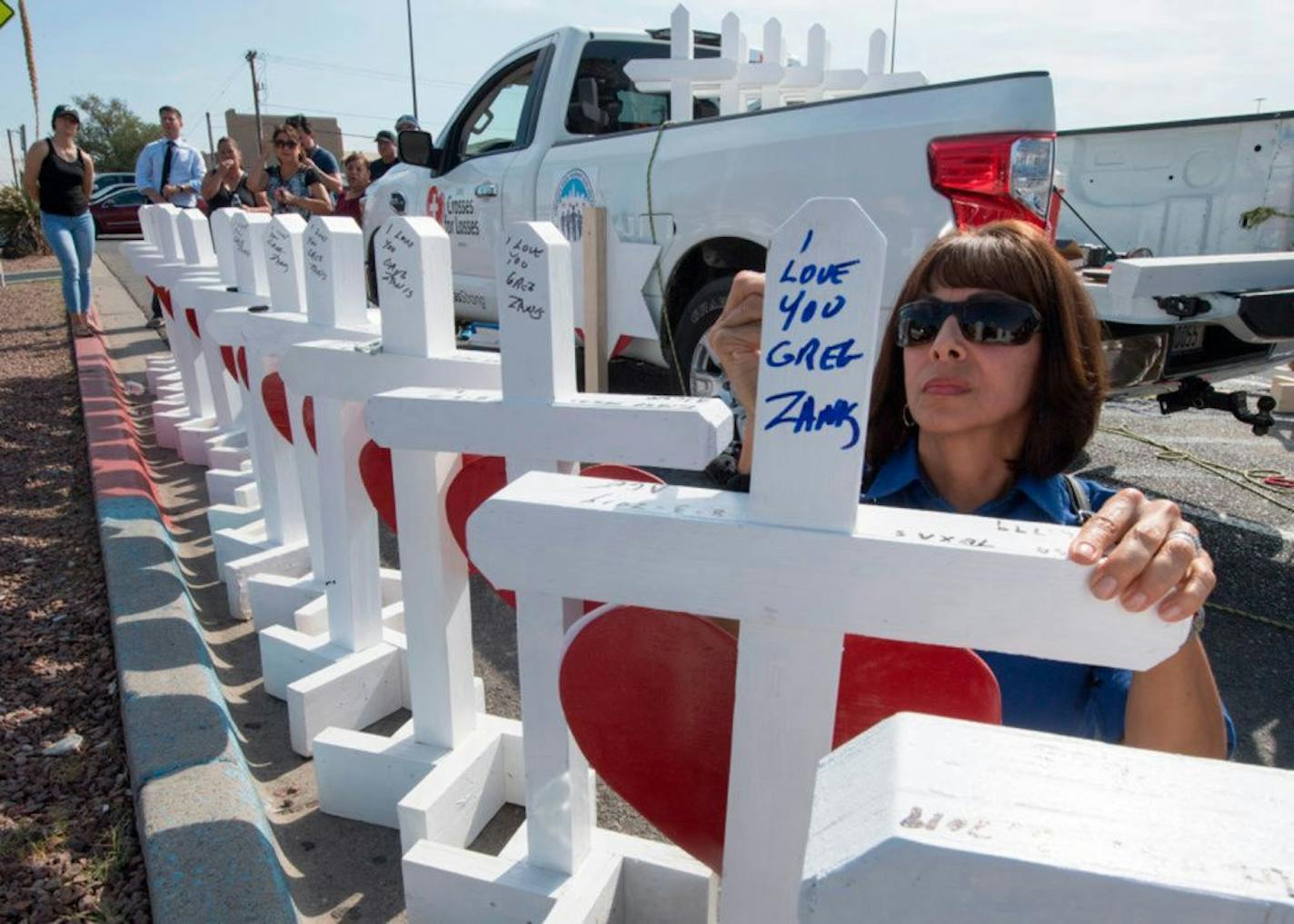 Members of the Crosses for Losses group arrived at the Cielo Vista Mall WalMart in El Paso, Texas, on Monday to commemorate those killed in a mass shooting on Saturday.