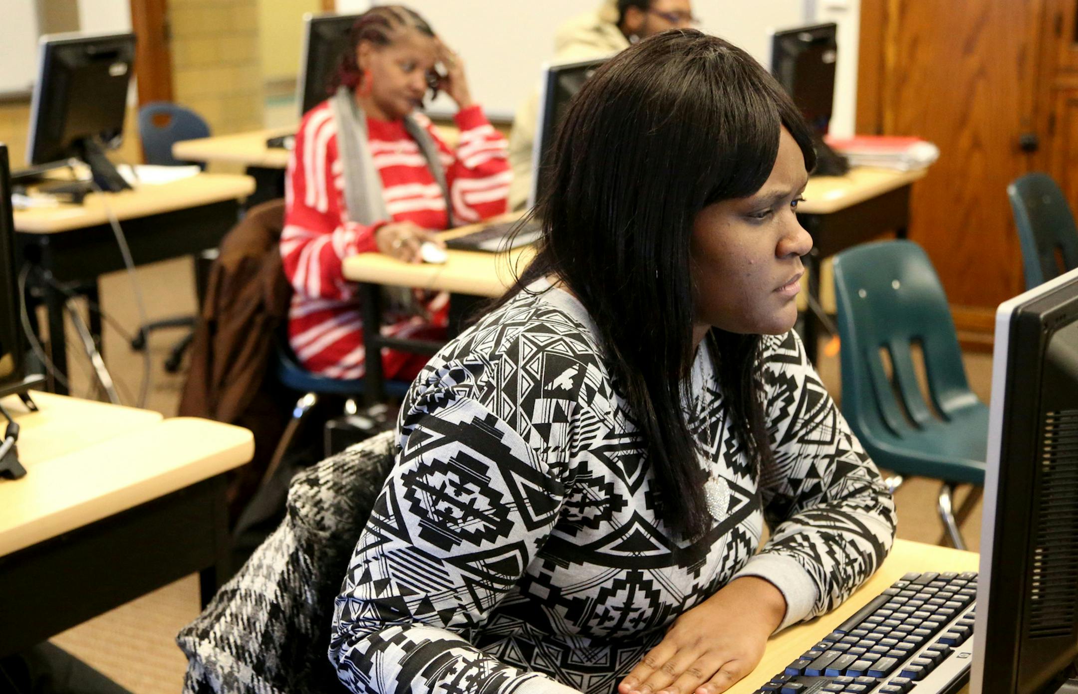 Kelly West works on her English skills during GED classes at the West Campus-Adult Education Center on Jan. 13, 2015 in Detroit, Mich. (Kirthmon F. Dozier/Detroit Free Press/TNS)