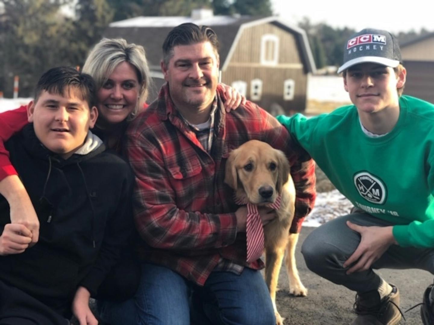 The family of Hill-Murray hockey player Charlie Strobel (from left): Brother Ryan, mother Jill, father Mike, Chevy the dog, Charlie.