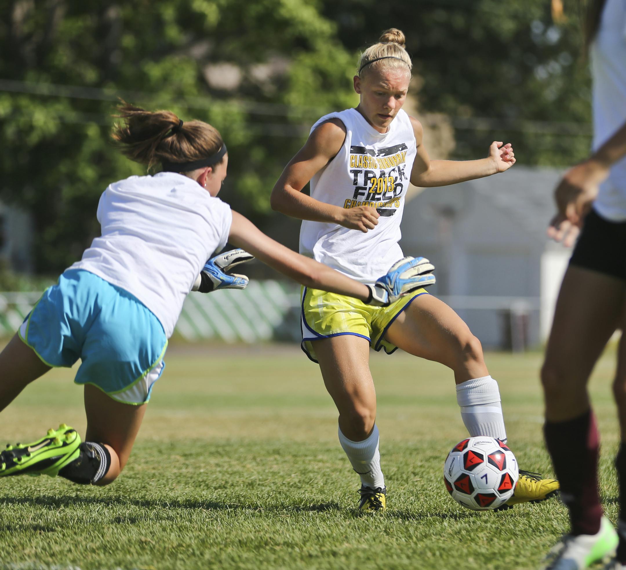 South St. Paul girls' soccer player Sonja Pearson kicked the ball past back up goalie Sydney Bennett during practice on Monday, August 26, 2013 at Roosevelt Field in South St. Paul. ] (RENEE JONES SCHNEIDER &#x2022; reneejones@startribune.com)