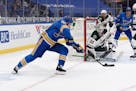 St. Louis Blues' Ryan O'Reilly scores the winning goal past the Wild's Cam Talbot during overtime of Saturday's game.