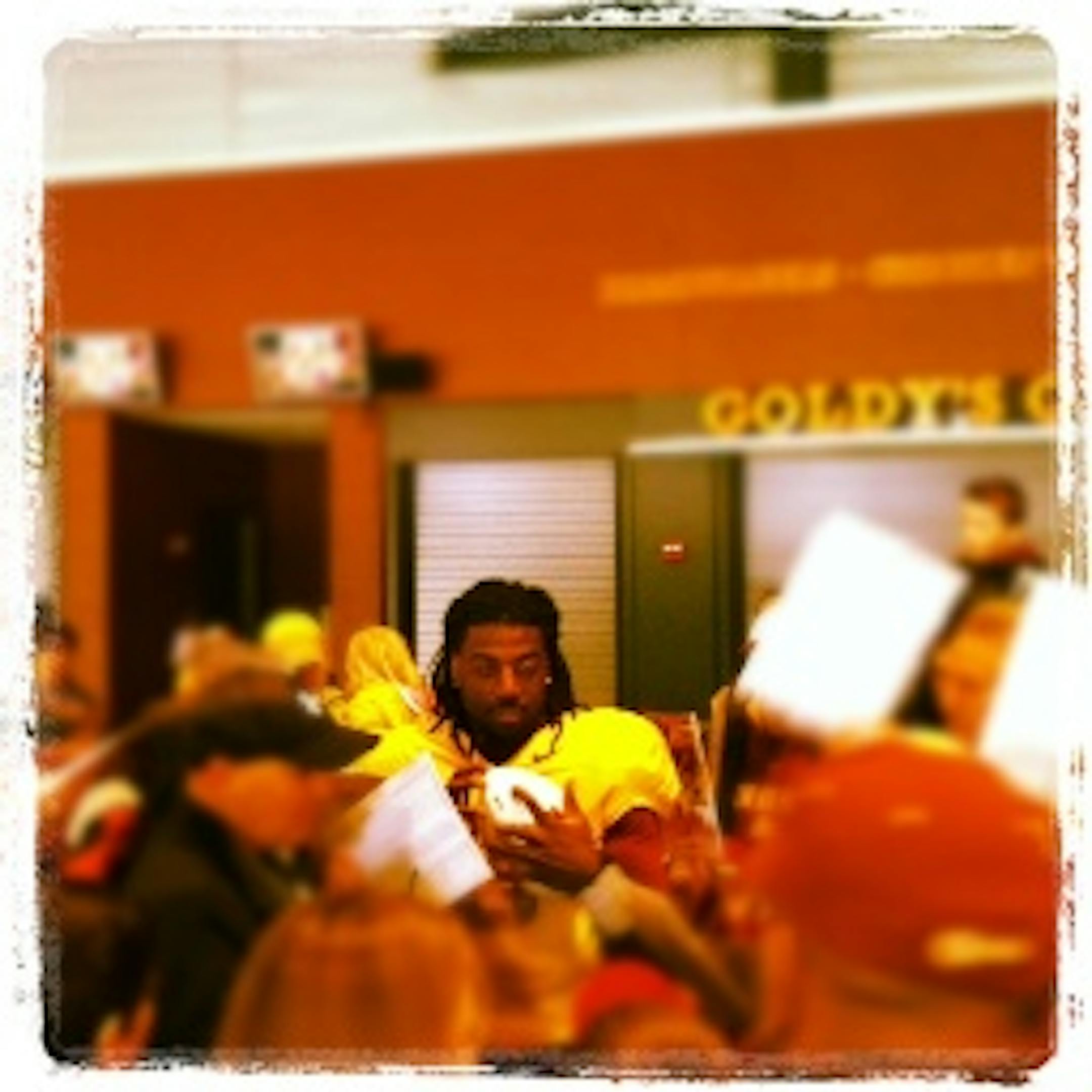 Starting QB MarQueis Gray signs autographs after the game in the concourse.