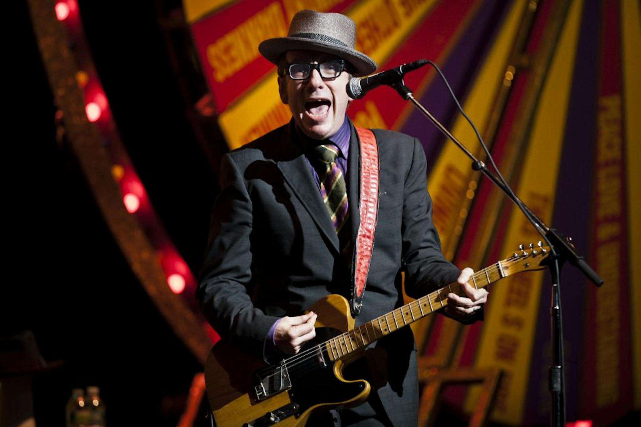 Elvis Costello & The Imposters perform at the Beacon Theatre in New York, May 23, 2011. Costello performed with the Spectacular Spinning Songbook where he used a cane to point out many hit songs from the past on Monday, the second of a three-night booking at the theater and part of an international tour.