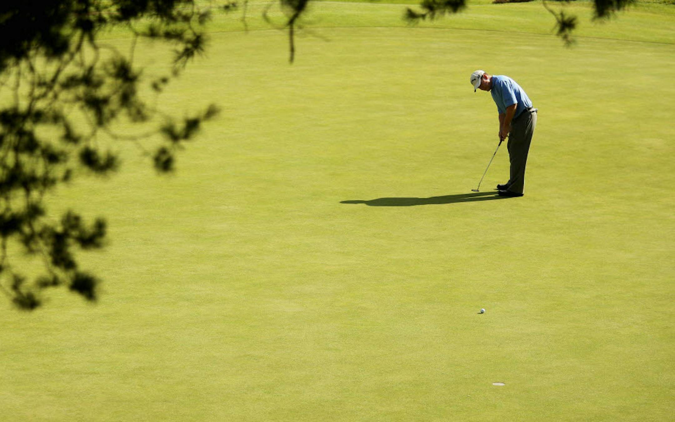 Tom Watson of the USA putts on the 13th green during the third round of The Senior Open Championship presented by MasterCard held on the Old Course at Sunningdale Golf Club on July 25, 2009 in Sunningdale, England.