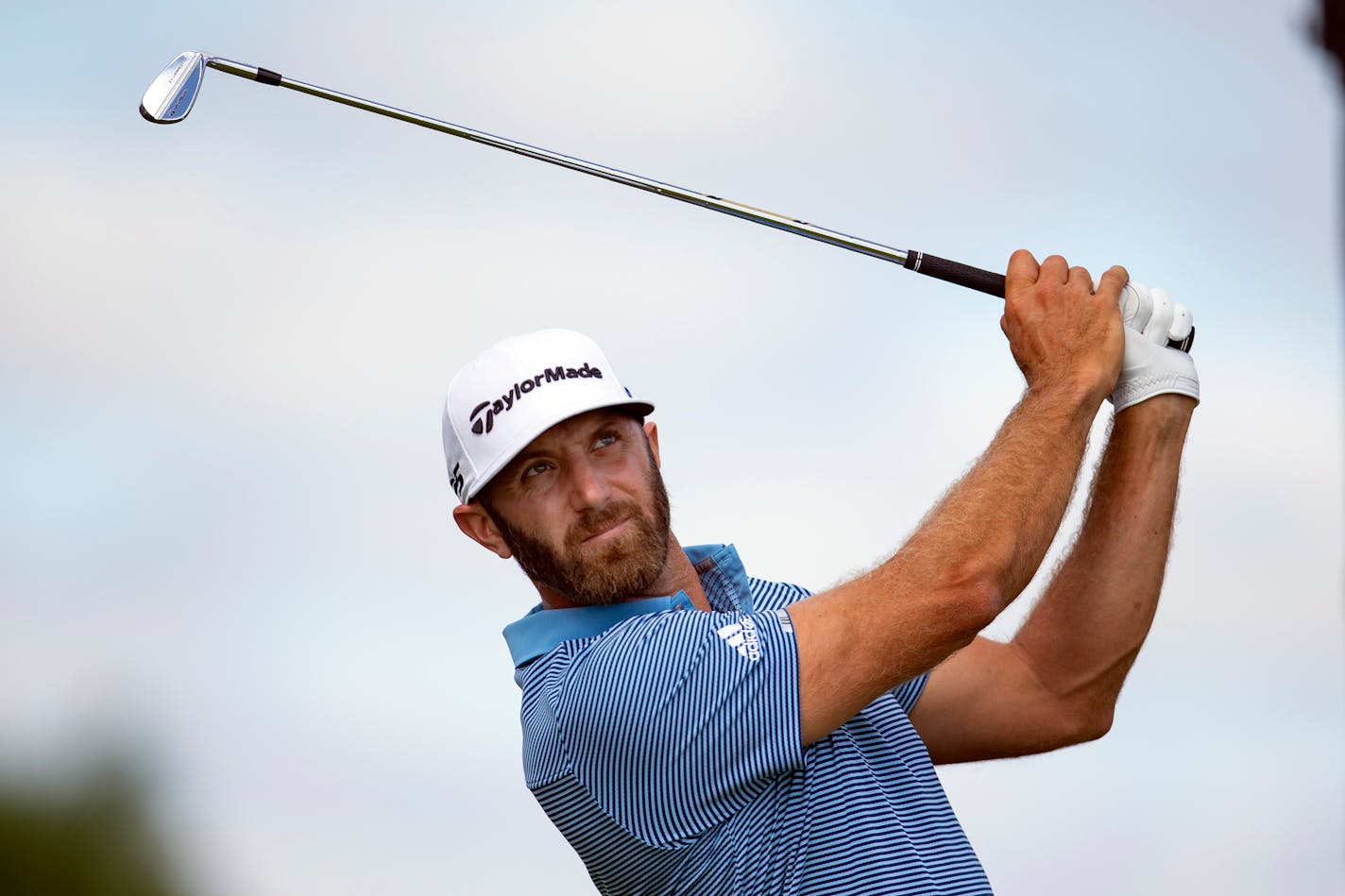 Dustin Johnson tees off on the fourth hole during the first round of the 3M Open