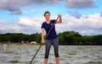 Megan Kelzenberg, a standup paddling instructor for Three Rivers Park District. ] GLEN STUBBE * gstubbe@startribune.com Friday, July 8, 2016 We are sh
