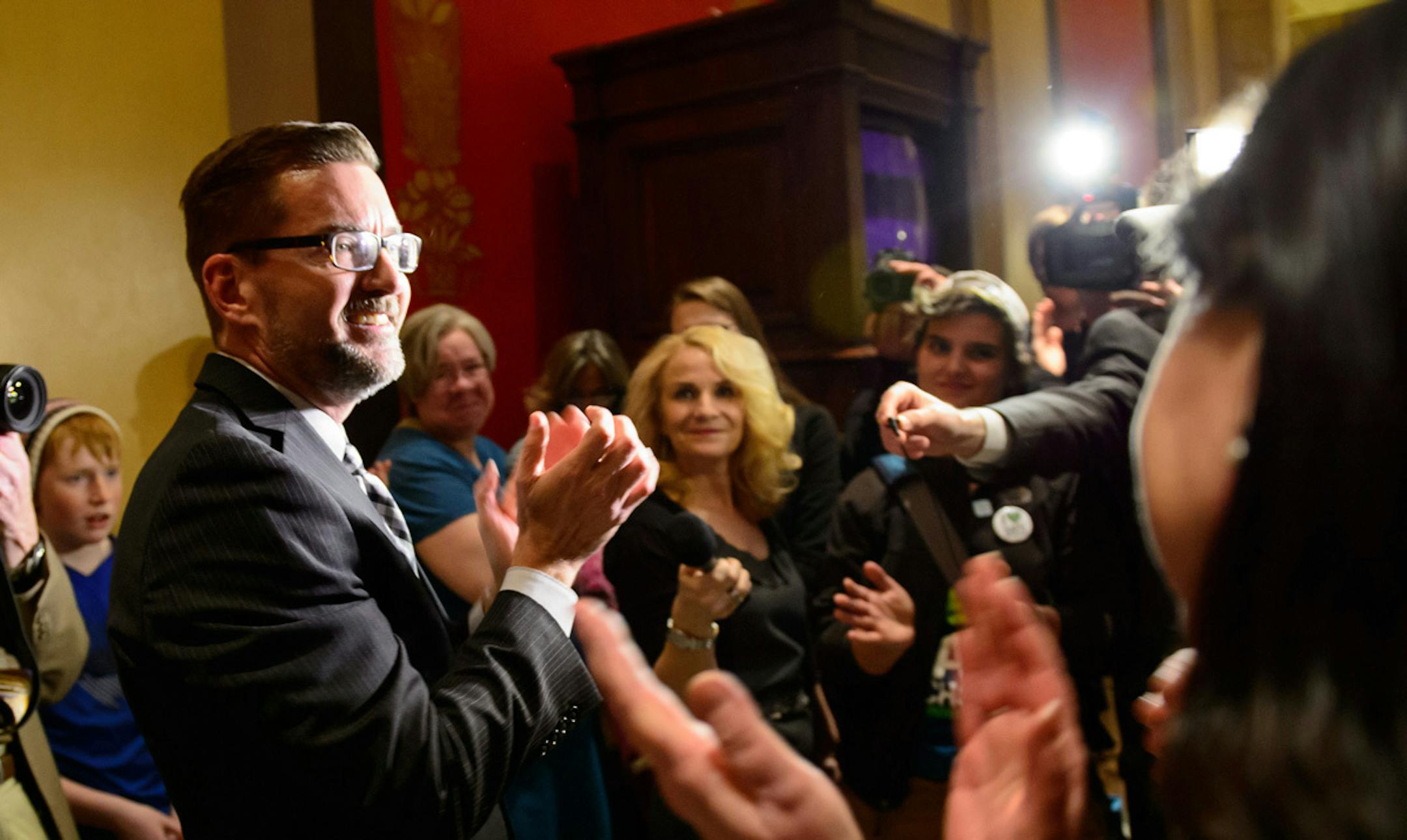 Members of Outfront Minnesota cheered for anti-bullying bill sponsor Sen. Scott Dibble after it passed 36-31. ] GLEN STUBBE * gstubbe@startribune.com Thursday, April 3, 2014.