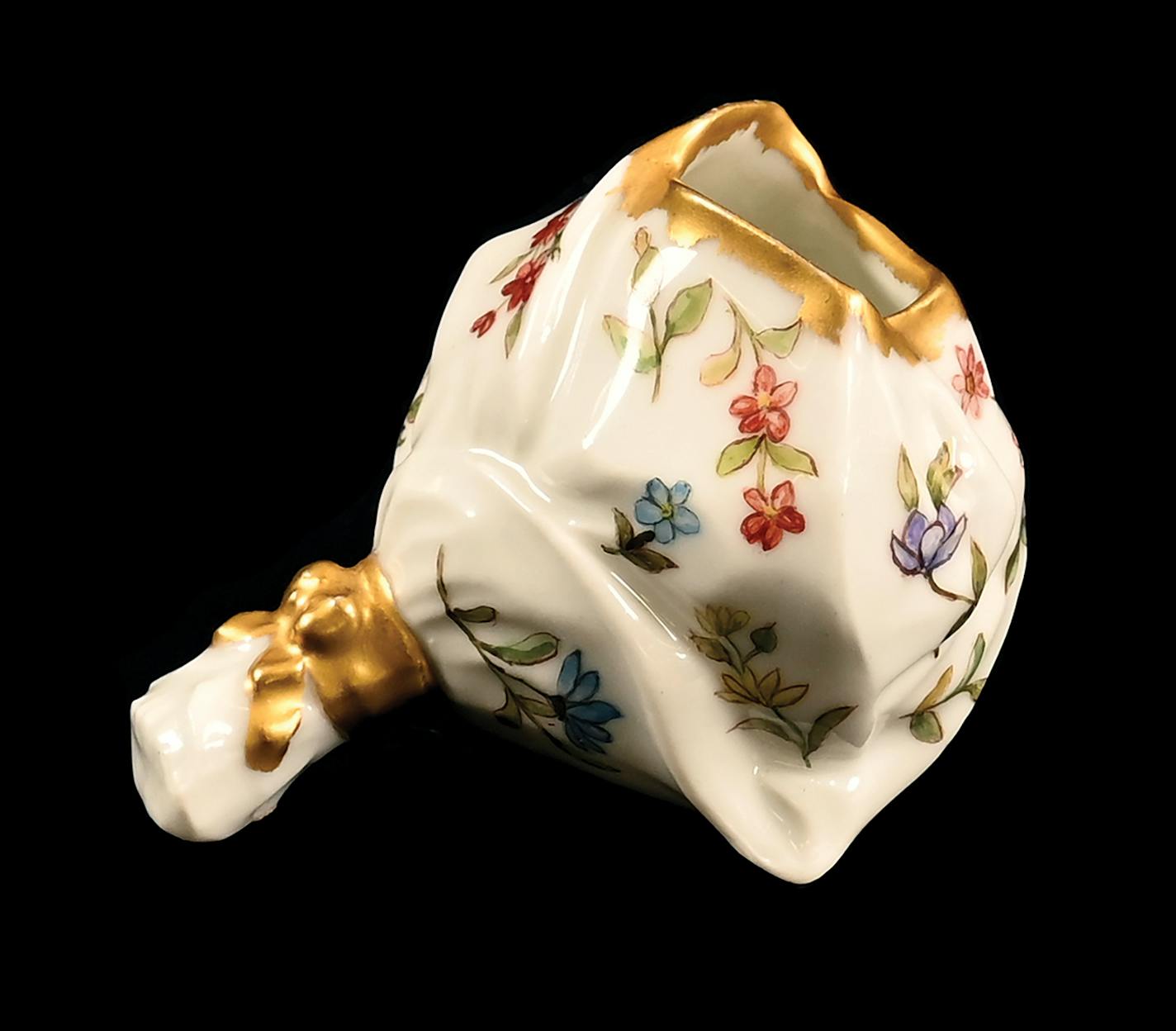 This Limoges porcelain piece originally held toothpicks. Now, it has found a new purpose, even if it's simply an attractive addition to a collection.