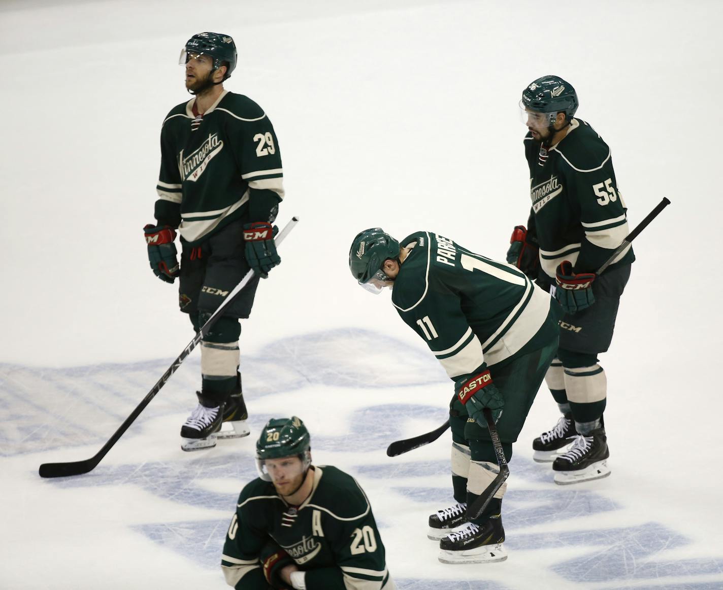 Minnesota Wild right wing Jason Pominville (29), defenseman Ryan Suter (20), left wing Zach Parise (11) and defenseman Matt Dumba (55) were dejected after their 4-3 loss to Chicago Thursday night. ] CARLOS GONZALEZ cgonzalez@startribune.com, May 7, 2015, St. Paul, MN, Xcel Energy Center, NHL, Minnesota Wild vs. Chicago Blackhawks, Game 4, Stanley Cup Playoffs, Round 2