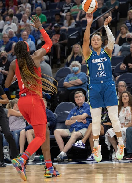 Minnesota Lynx guard Kayla McBride (21) went up for three during the first quarter.