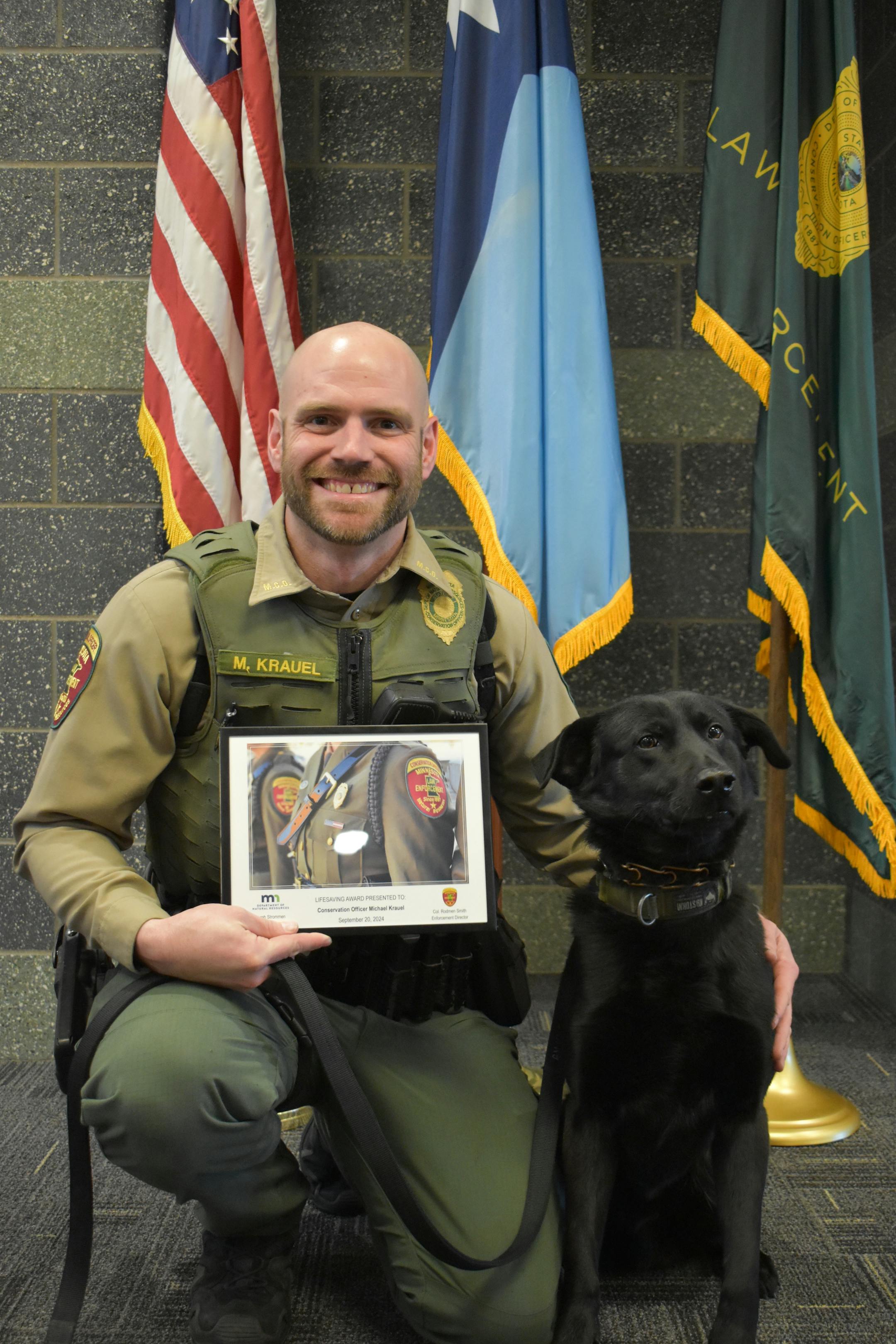 DNR conservation officer Mike Krauel and K9 Bolt. Bolt was the first to find a lost hunter, after dark.
