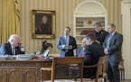 FILE - In this Jan. 28, 2017 file photo, President Donald Trump, accompanied by from second from left, Chief of Staff Reince Priebus, Vice President M