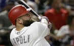 Texas Rangers' Mike Napoli follows through on a swing against the Detroit Tigers in a baseball game, Monday, Aug. 14, 2017, in Arlington, Texas. (AP P