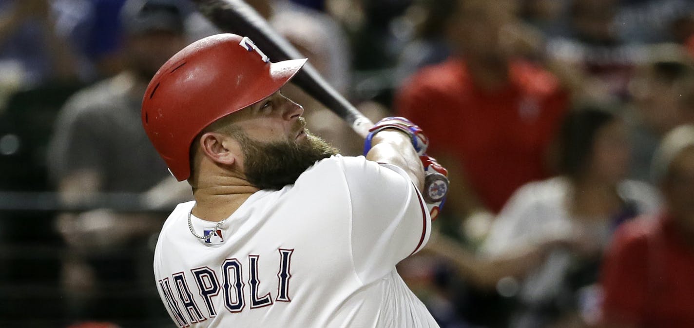 Texas Rangers' Mike Napoli follows through on a swing against the Detroit Tigers in a baseball game, Monday, Aug. 14, 2017, in Arlington, Texas. (AP Photo/Tony Gutierrez) ORG XMIT: OTKTG151