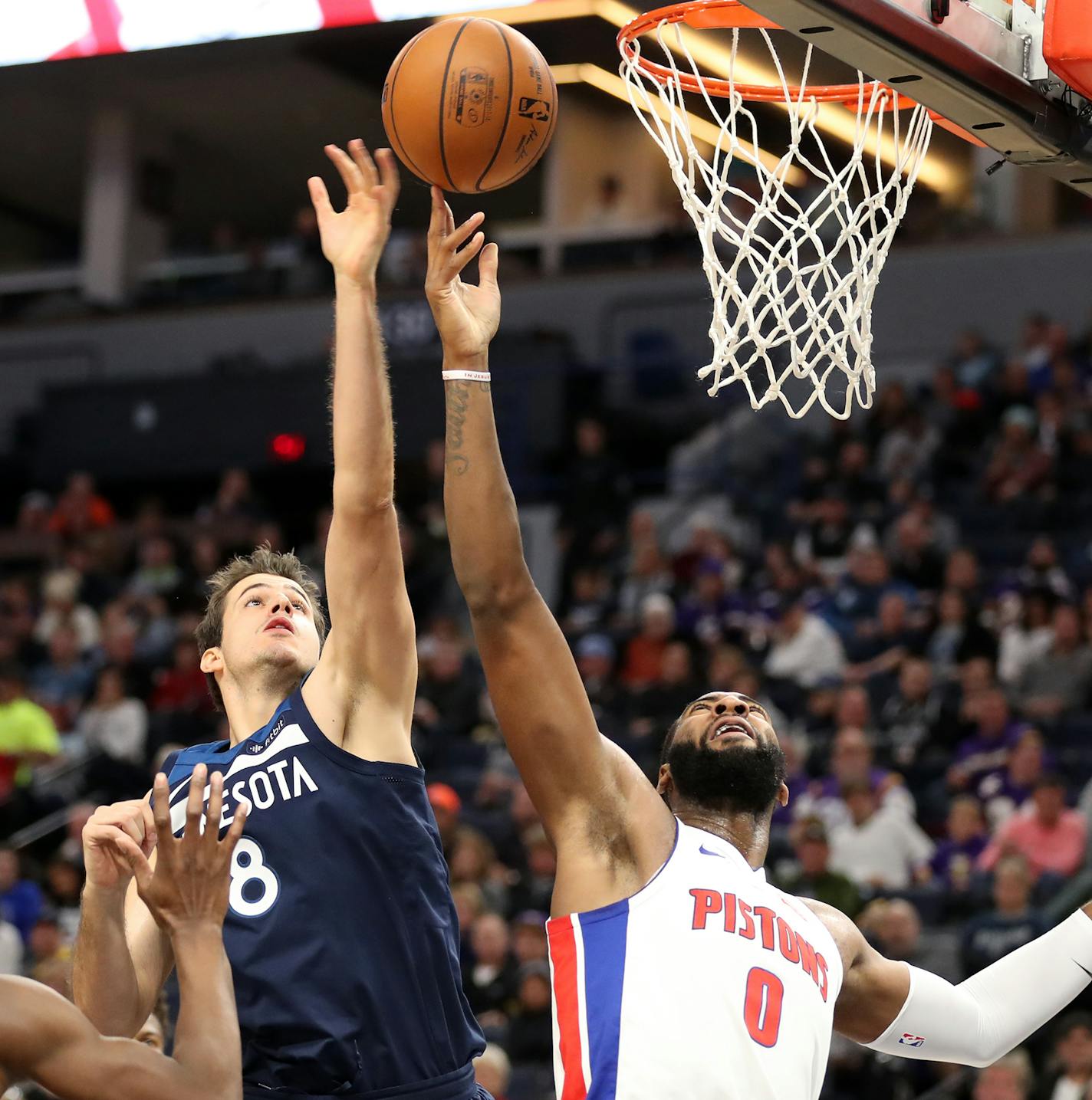 Detroit Pistons center Andre Drummond (0) shoots as Minnesota Timberwolves forward Nemanja Bjelica (8) defends during the second half. ] LEILA NAVIDI &#xef; leila.navidi@startribune.com BACKGROUND INFORMATION: The Minnesota Timberwolves play against the Detroit Pistons at Target Center in Minneapolis on Sunday, November 19, 2017. The Detroit Pistons won 100-97.