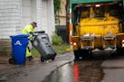 Waste Management worker Daniel Westerhaus collected trash from the alleys of St. Paul's Snelling Hamline neighborhood.