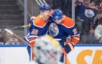 The Oilers' Zach Hyman (18) and Leon Draisaitl (29) celebrate a goal against the Penguins during the second period Sunday night.