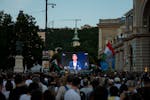 People listen to the speech of Peter Magyar during the debate in Budapest, Thursday May 30, 2024, ahead of the European Parliament elections, The deba