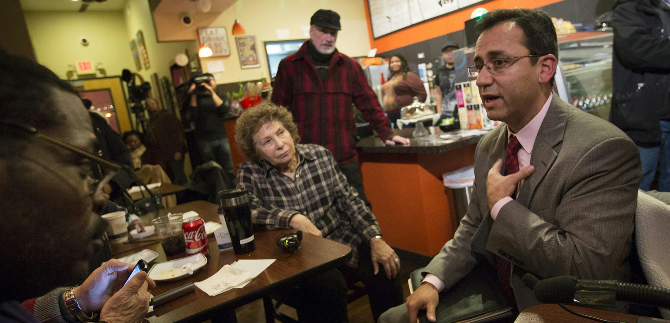 Sergio Paez spoke to the media and members of the public that showed up to question him in his continuing mission to secure the job of superintendent of Minneapolis Public Schools at Sammy'a Avenue Eatery on Tuesday, January 5, 2015, in Minneapolis, Minn. ] RENEE JONES SCHNEIDER &#x2022; reneejones@startribune.com The woman at left is Ruth Usen who came to ask some questions. ORG XMIT: MIN1601051918590916