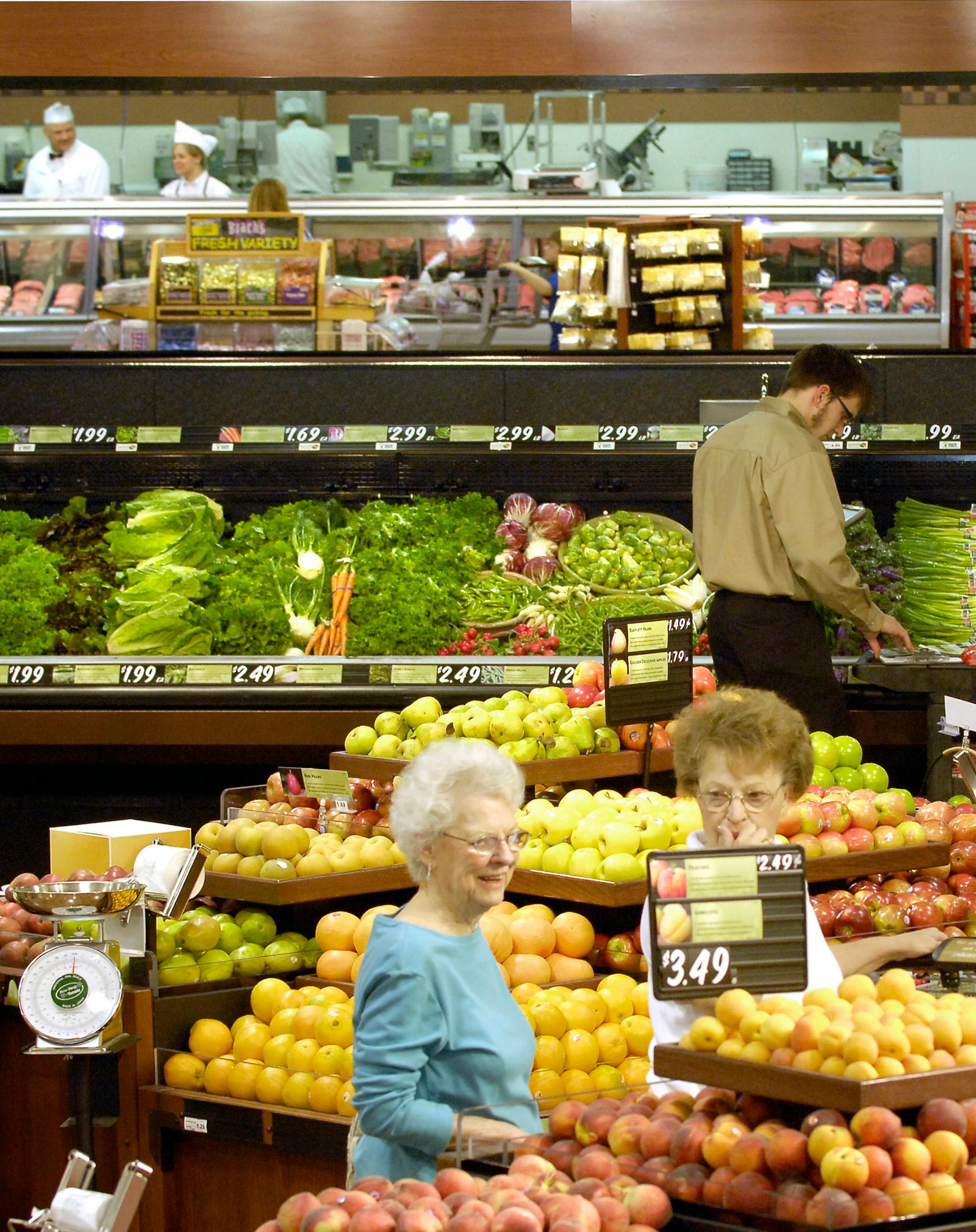"I need to start wearing an evening gown to shop here, it's so nice," said Diane McGinley, right, of North Hudson, Wis., as she entered Nash Finch's new Family Fresh Market with her mother, Mary Brandt.